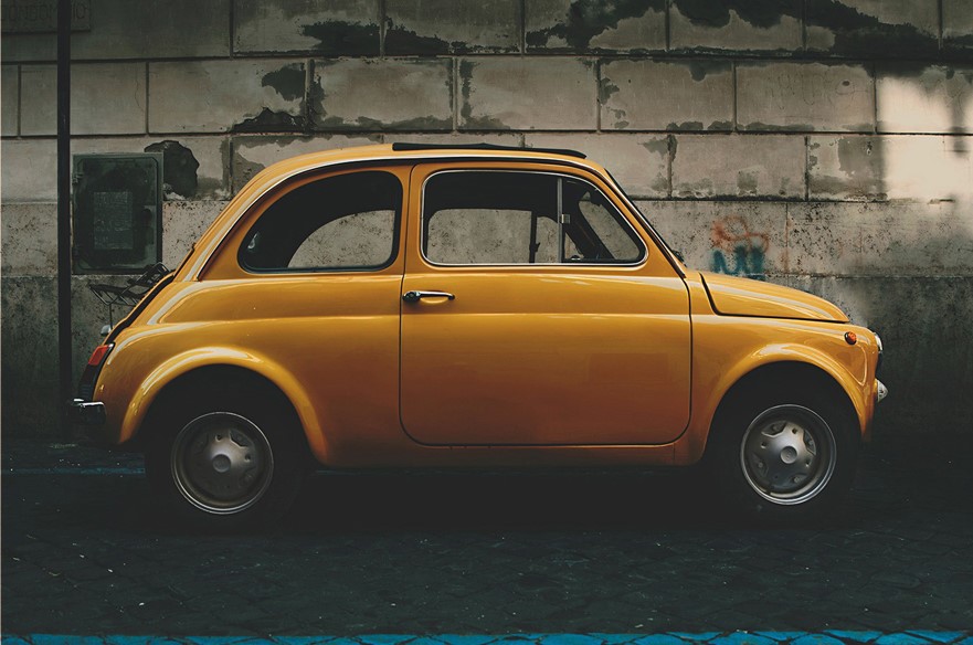 yellow compact car for delivery